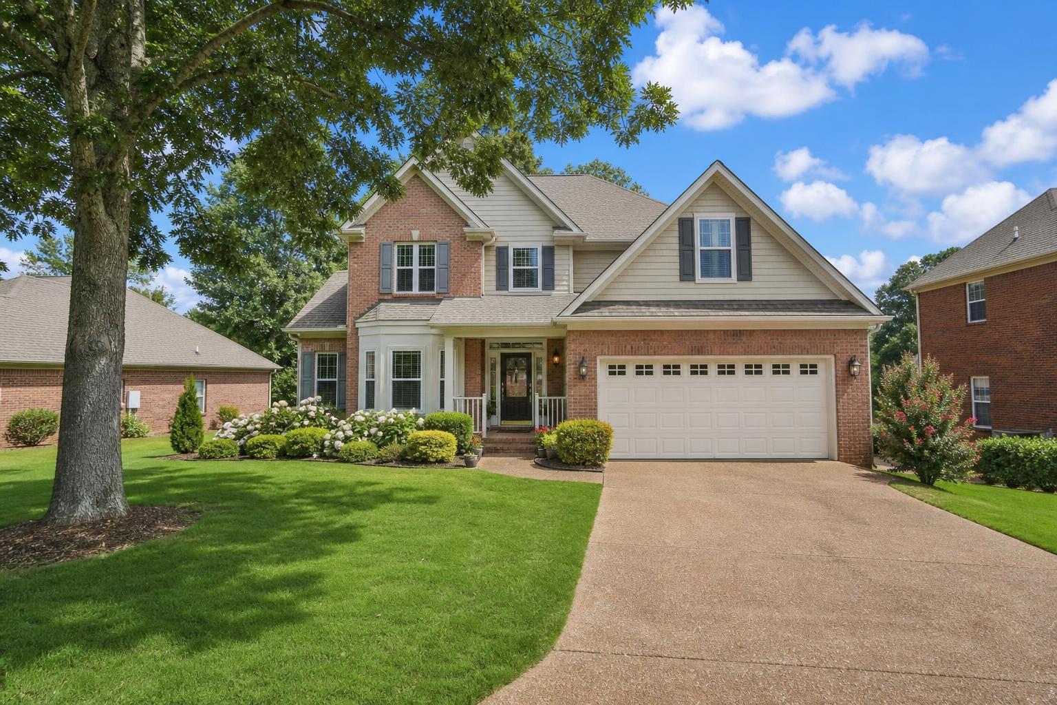 Happy family with keys in front of their new Memphis home